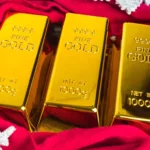 Gold dips to three-week low as US-China trade hopes fade