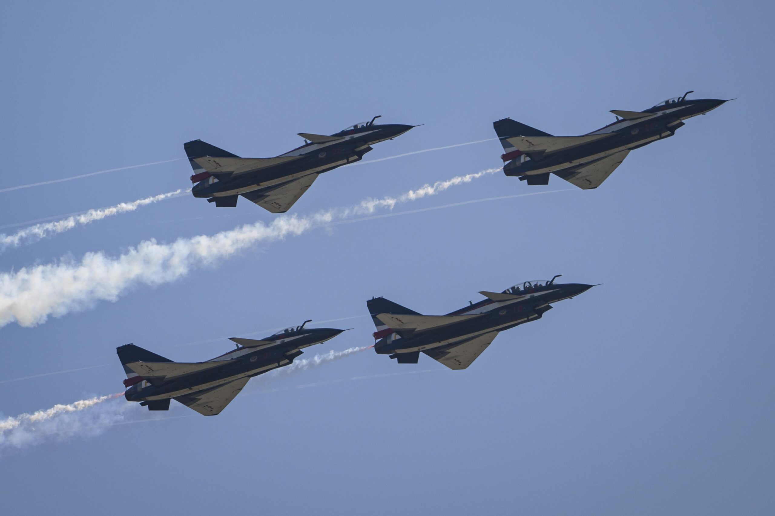Taiwan leader vows defense as China conducts war games