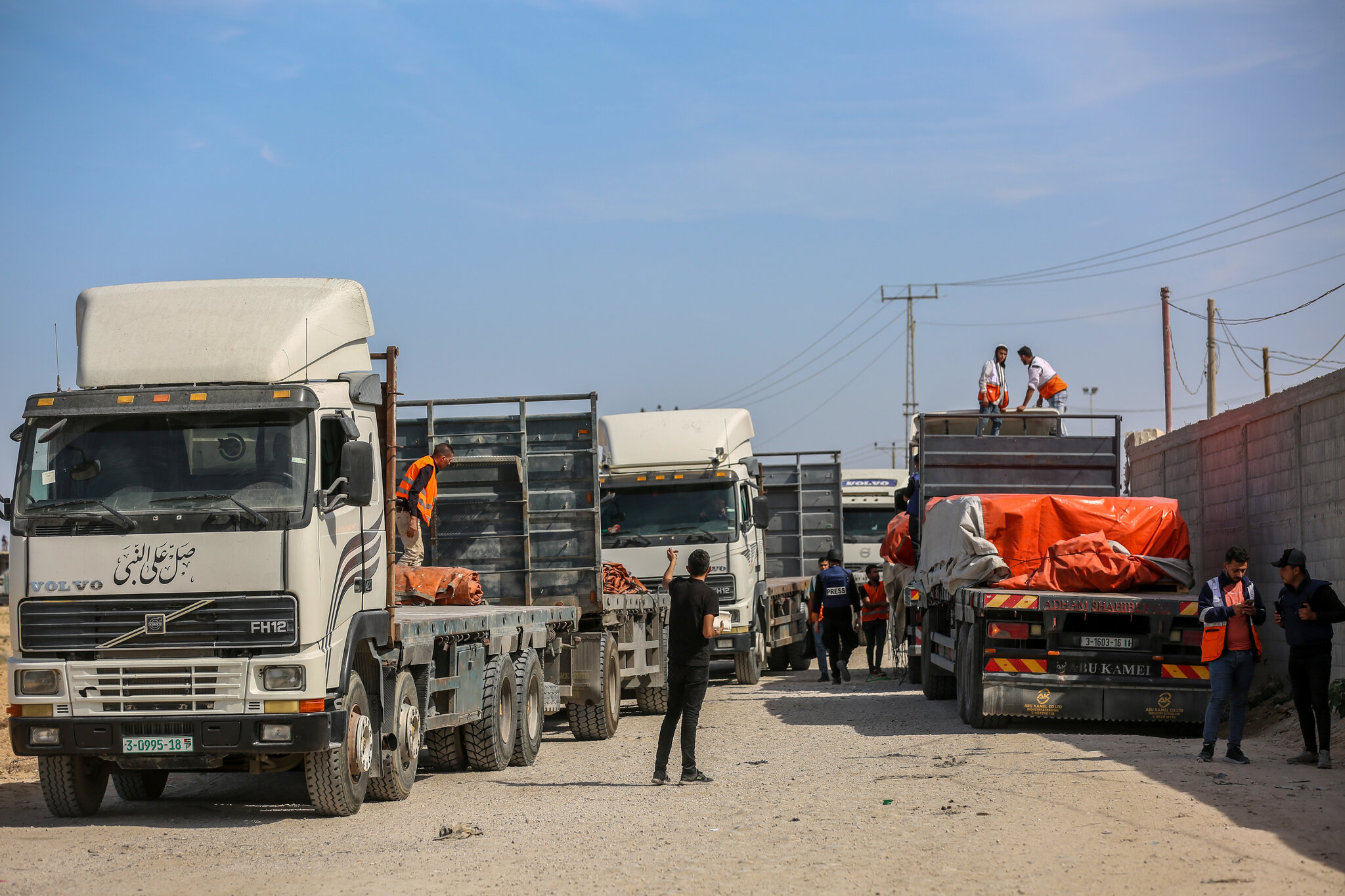 Israel vows full control of Gaza as aid trucks arrive
