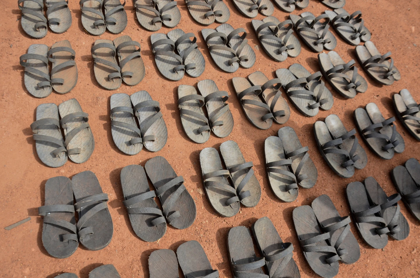 S Sudanese craft sandals from tires to survive economic collapse