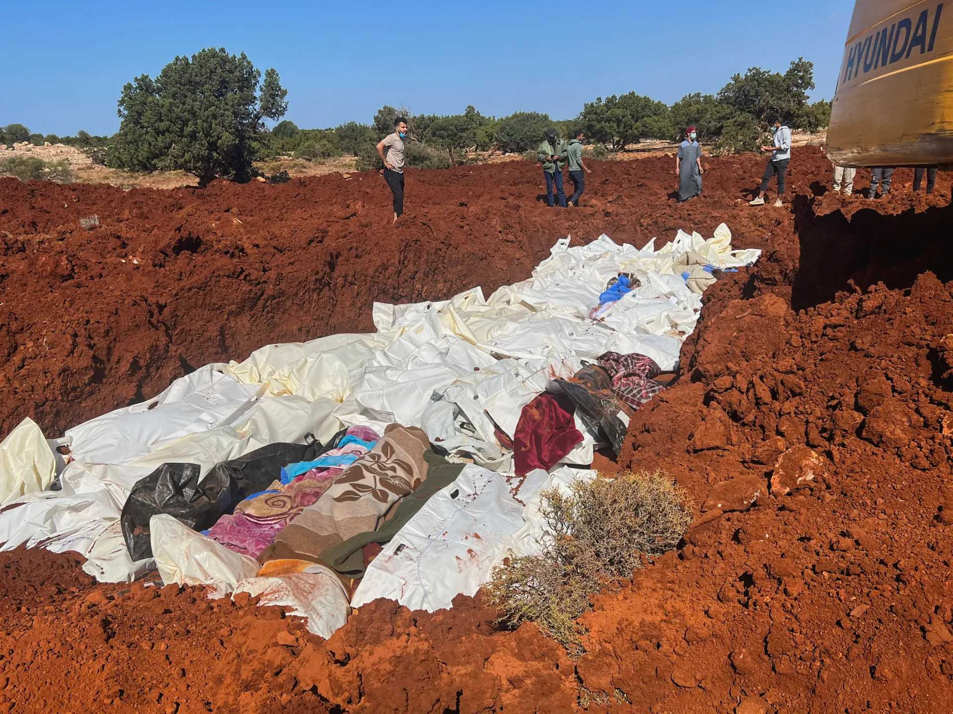 Libya moves to try gang suspect tied to mass grave of migrants