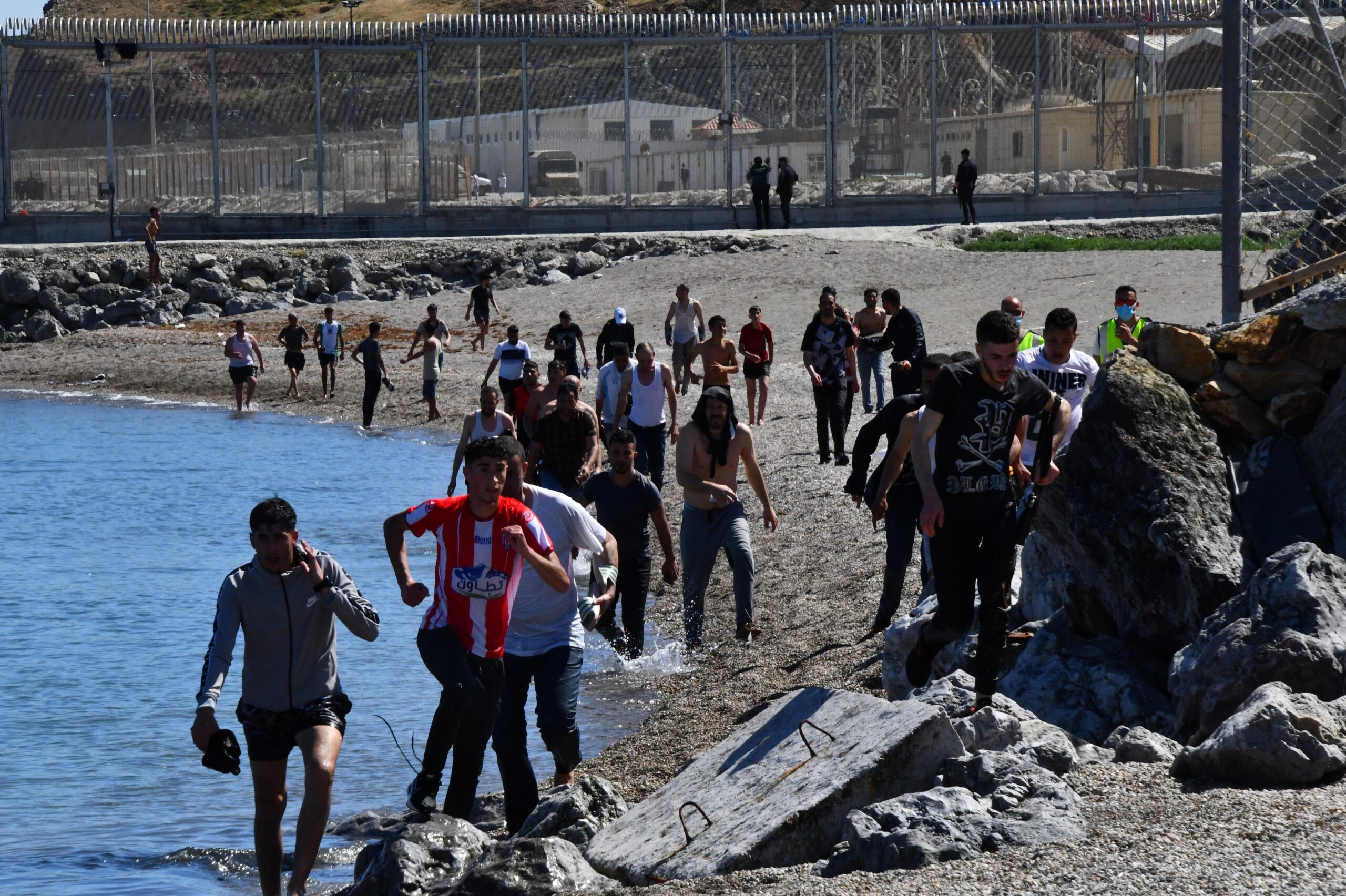 Ceuta overwhelmed as thousands of migrants cross from Morocco