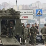 Morocco sends riot police and ships to secure Ceuta border